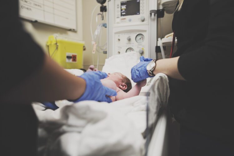 Newborn being measured at Calgary hospital